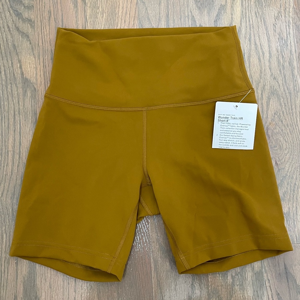 NWT Wunder Train high rise biker short in Golden Spice